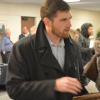 A student engaged in conversation at the Academic Major Fair.
